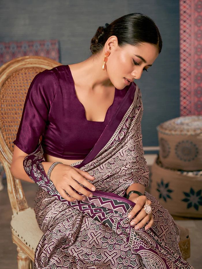 Close-up of intricate geometric and floral block print patterns on smooth drape fabric