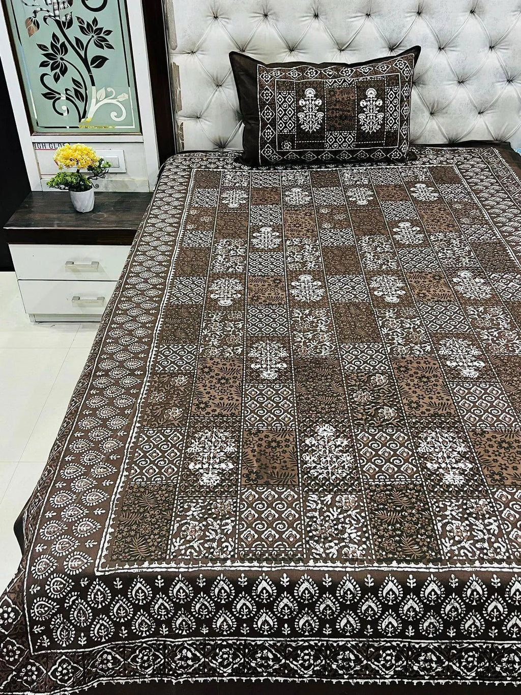 Brown Dabu print pure cotton single bedsheet with matching pillow cover on a bed