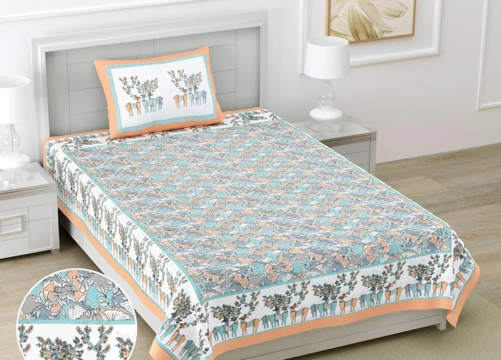 Orange and teal floral print single cotton bedsheet on a bed with matching pillow cover