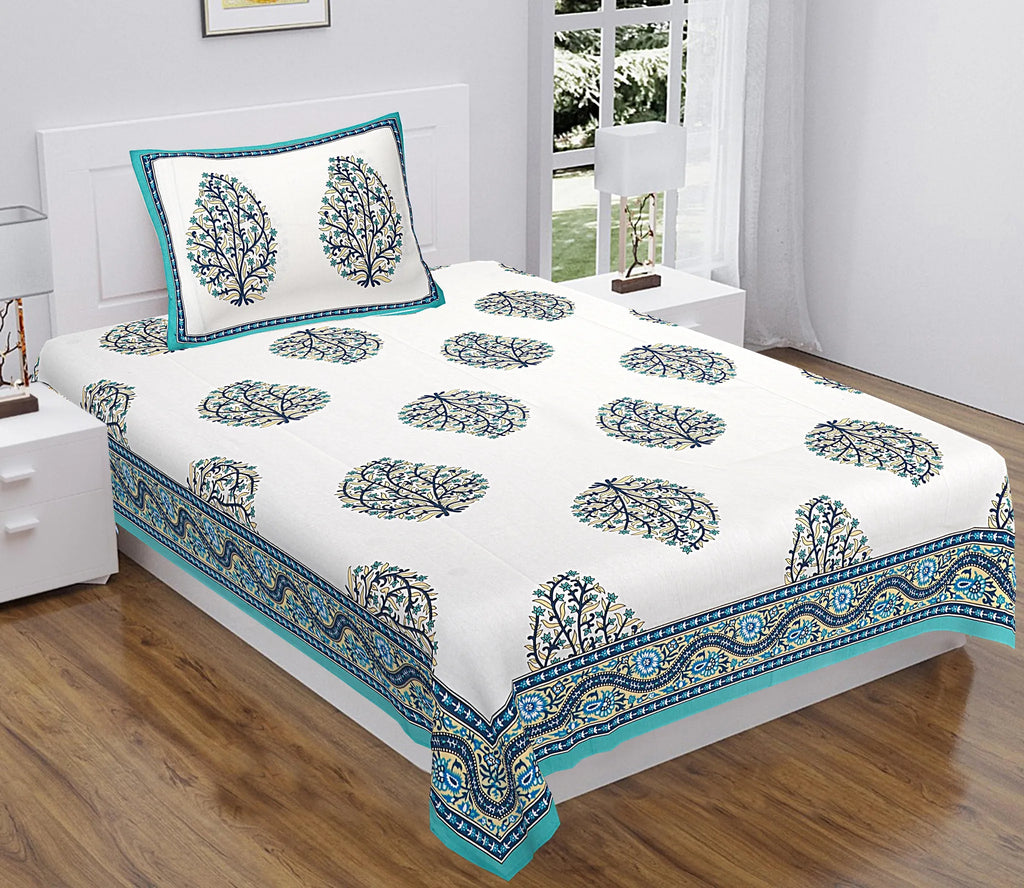Teal and blue Dabu block print single bedsheet with matching pillow cover on bed