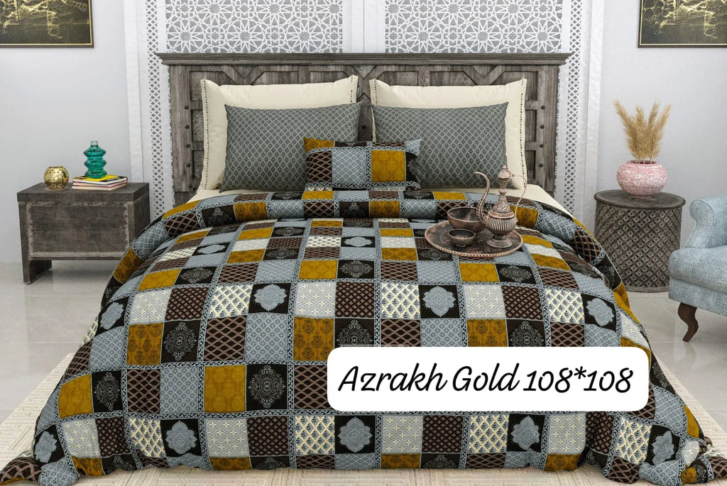Blue and gold patchwork cotton bedsheet on a bed with two matching pillow covers