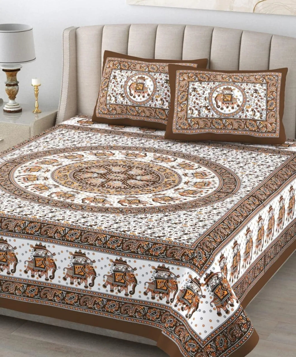 Brown and white elephant print pure cotton bedsheet with two matching pillow covers on bed