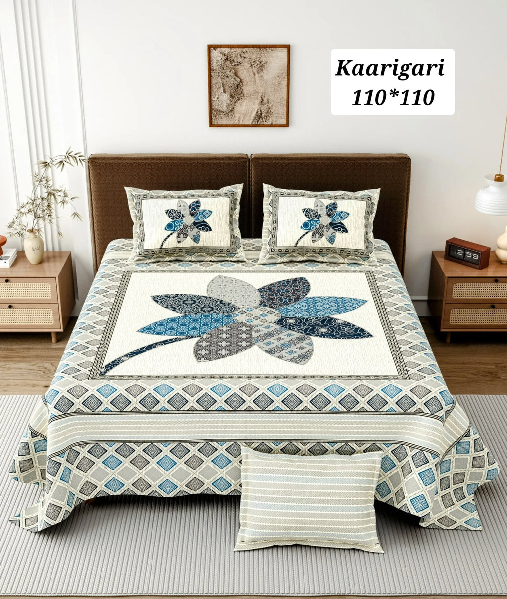 Blue floral print cotton bedsheet with matching pillow covers on bed