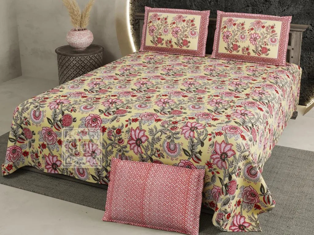 Yellow floral print cotton super king bedsheet with pillow covers on bed