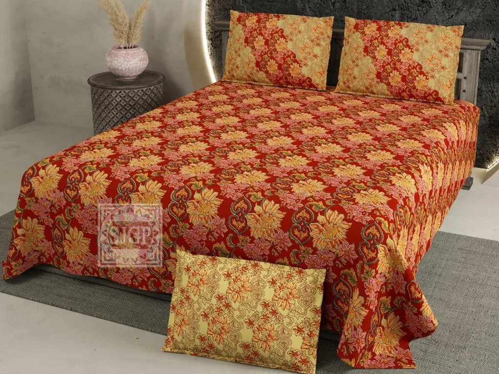Red floral print cotton super king bedsheet with pillow covers on bed