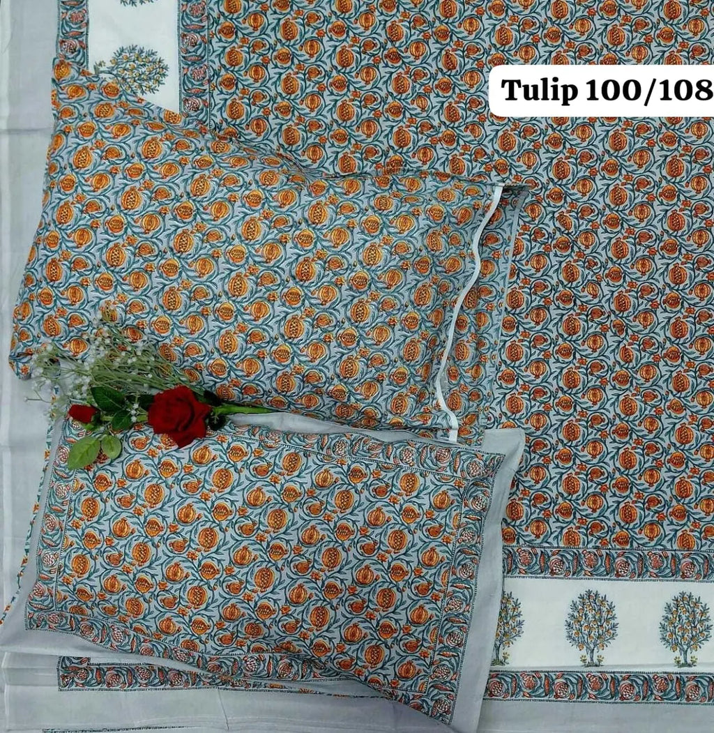 Grey cotton bedsheet with orange pomegranate print and two matching pillow covers
