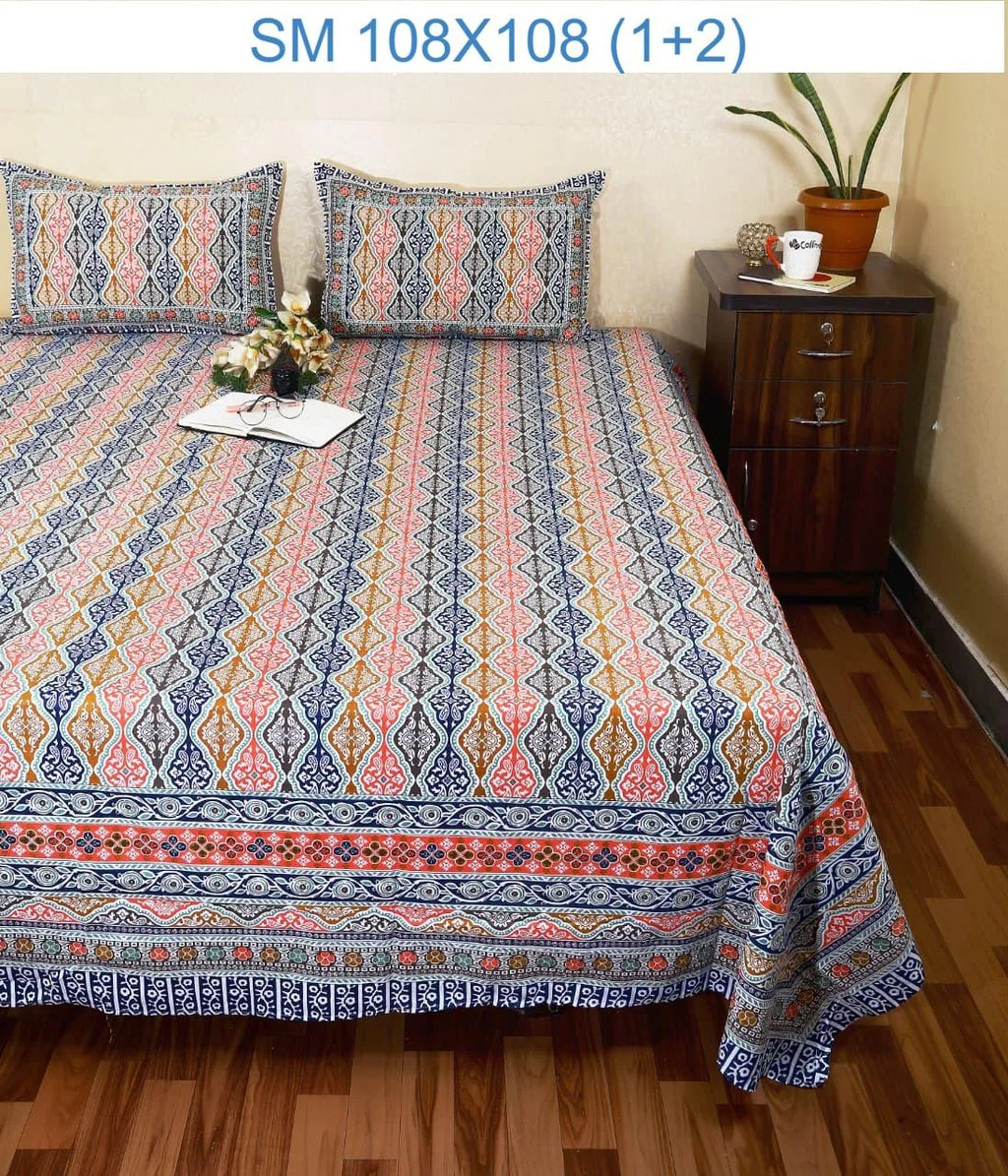Multi color geometric and floral print cotton bedsheet with two matching pillow covers on bed