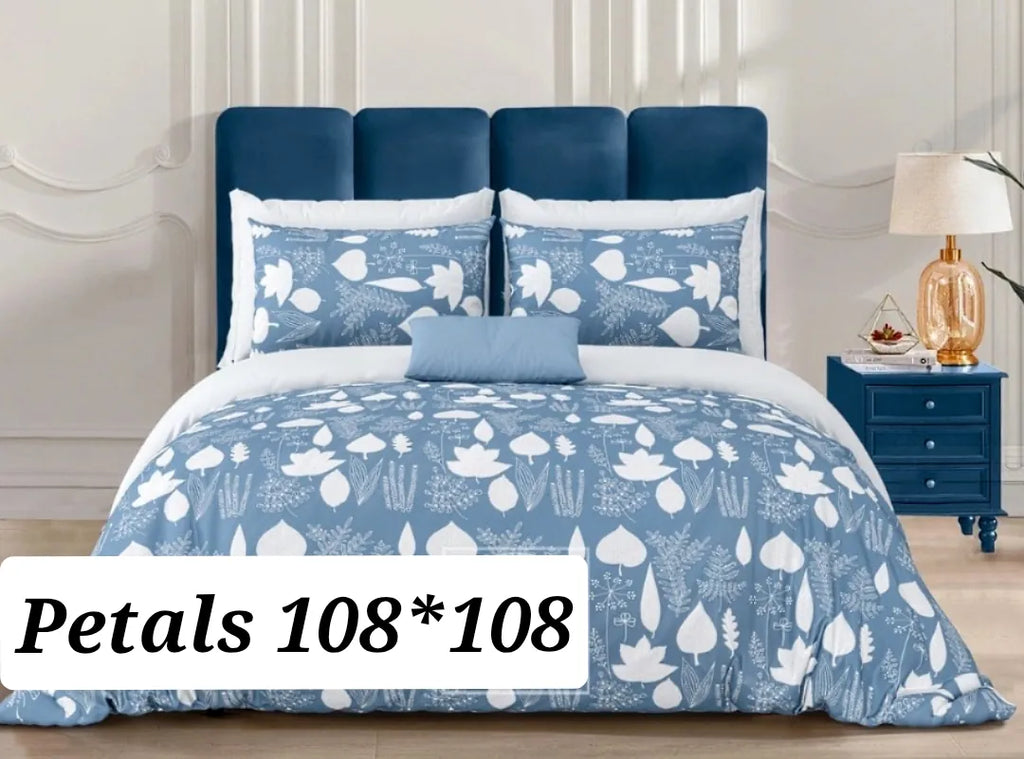 Blue Petals 108x108 cotton bedsheet with two pillow covers on a made bed