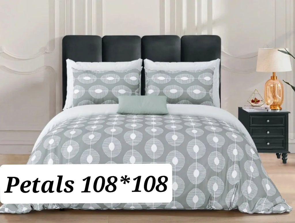 Grey geometric petal print cotton super king bedsheet on bed with two matching pillow covers