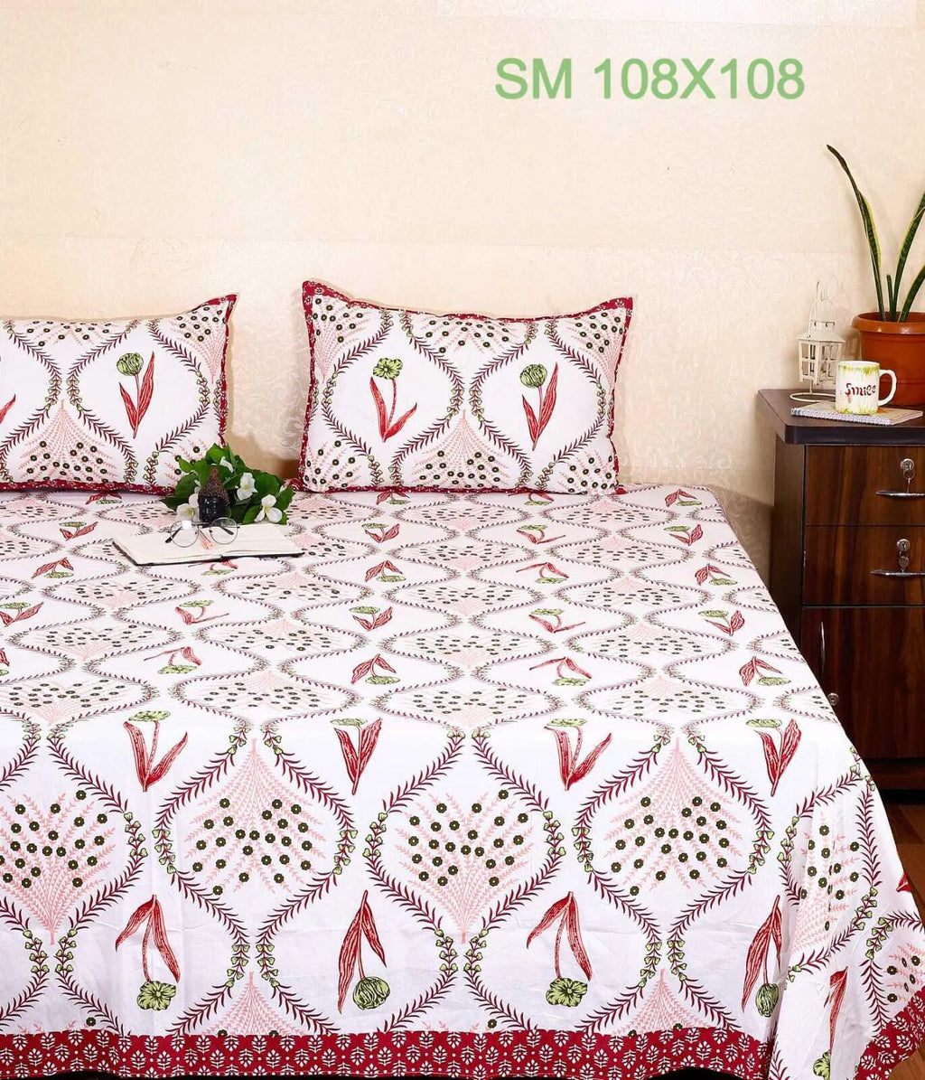 White and red tulip print cotton super king bedsheet with matching pillow covers on bed