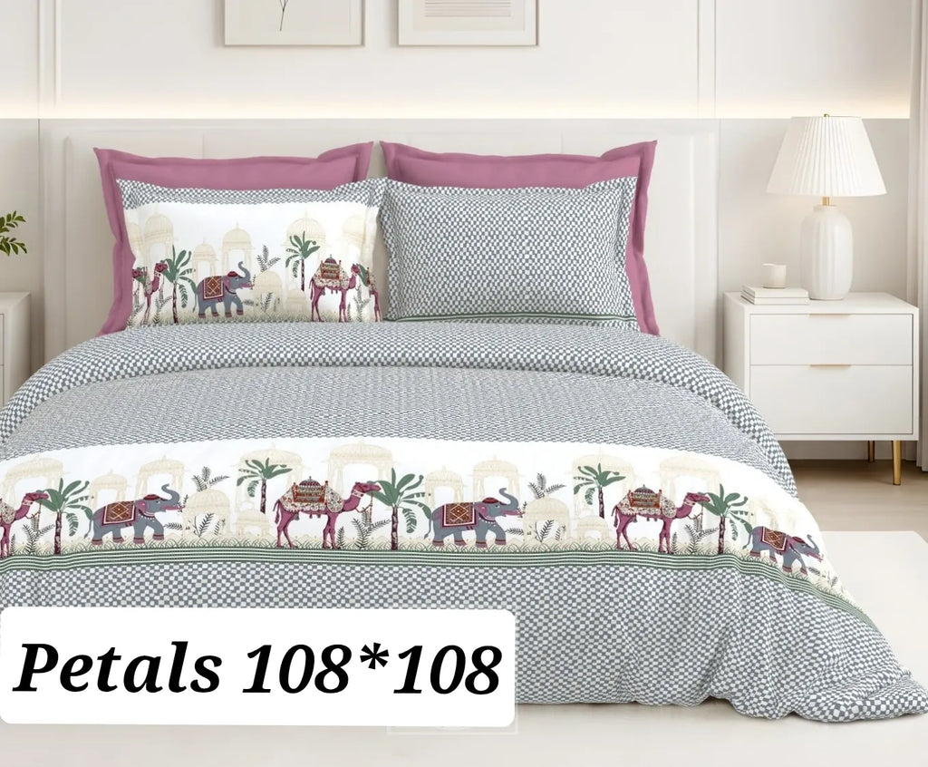 Grey and white traditional elephant print cotton bedsheet with pink pillows on bed