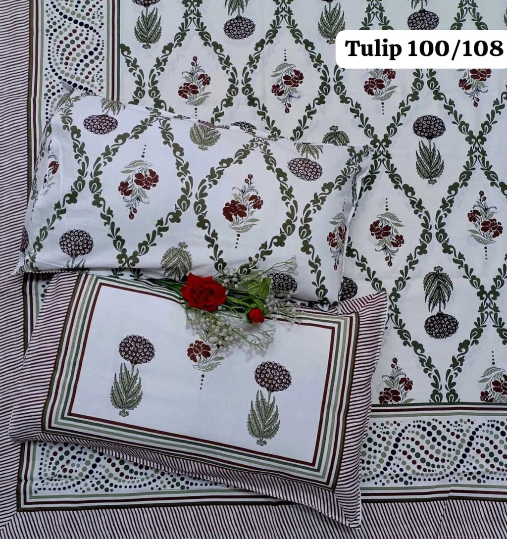 White cotton bedsheet with maroon and green floral print and two matching pillow covers