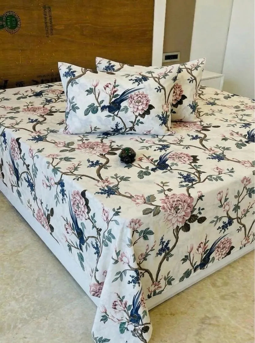 White cotton super king bedsheet with pink branch and bird print and matching pillows