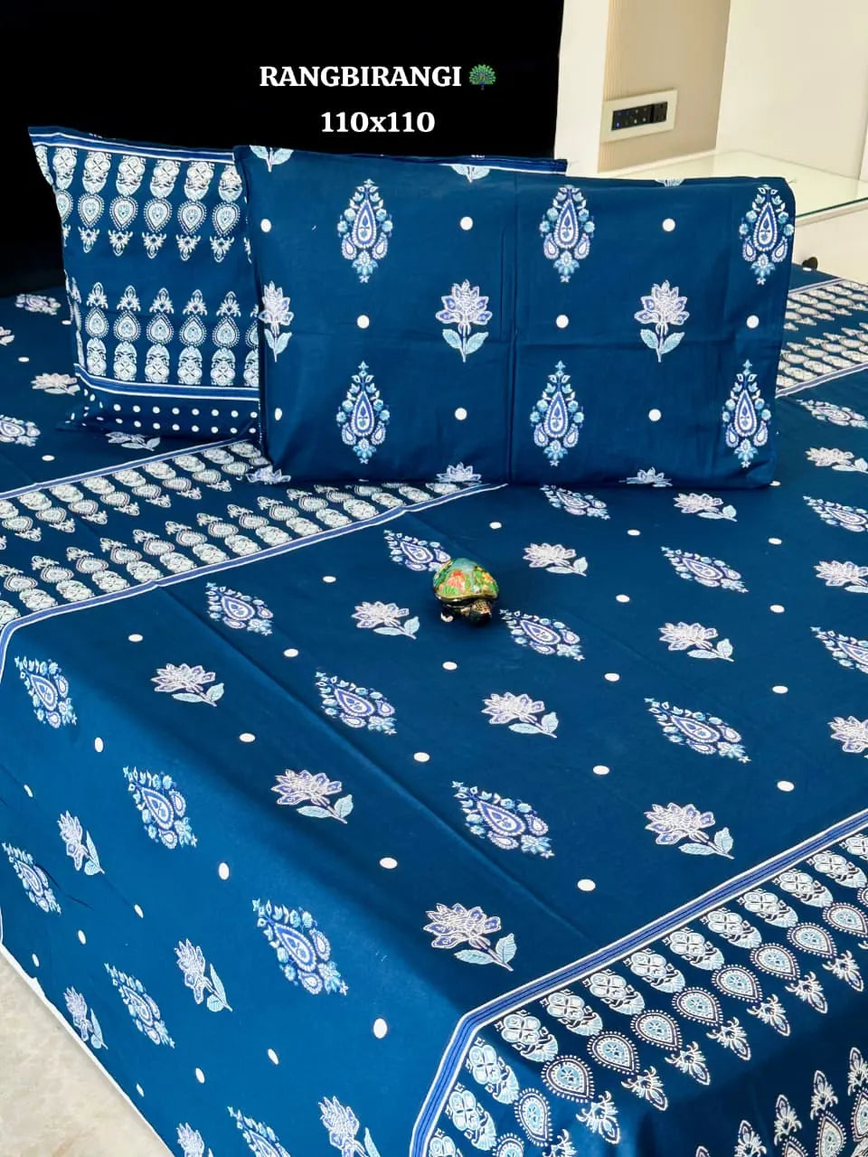 Blue cotton super king bedsheet with white floral print and matching pillow covers