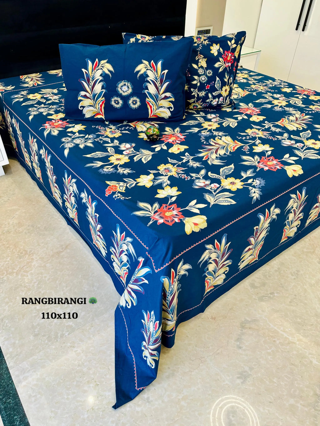 Deep blue cotton super king bedsheet with floral print and matching pillow covers
