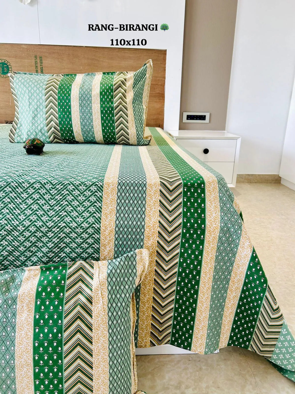 Green and gold striped cotton super king bedsheet with matching pillow covers on bed