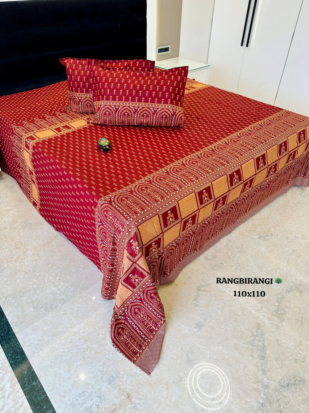 Red cotton super king bedsheet with traditional border print and matching pillow covers