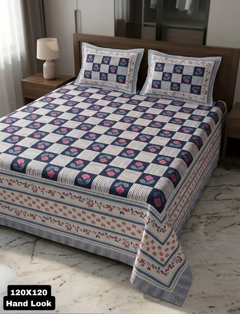 Navy blue and white checker pattern super king cotton bedsheet with pillow covers on wooden bed