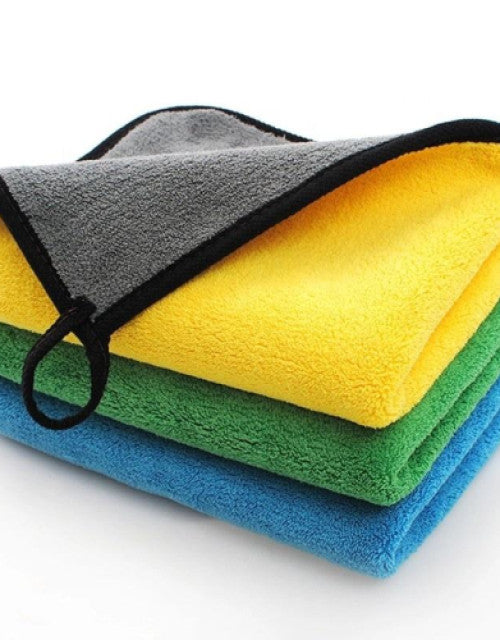 Stack of yellow 100% microfiber car wash and detailing towels