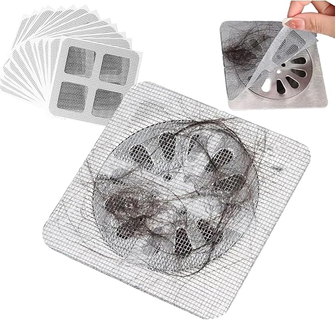 Hand removing used disposable bathroom drain cover with hair from shower, preventing blockages easily.