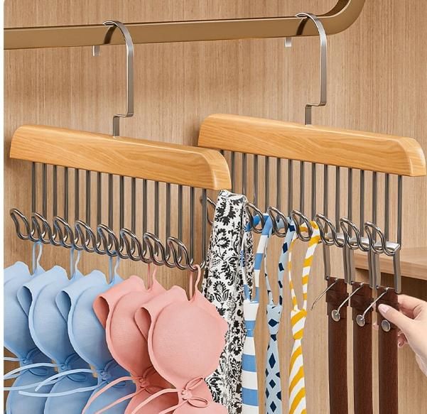 Multifunctional wooden hanger featuring multiple metal hooks for organizing accessories.