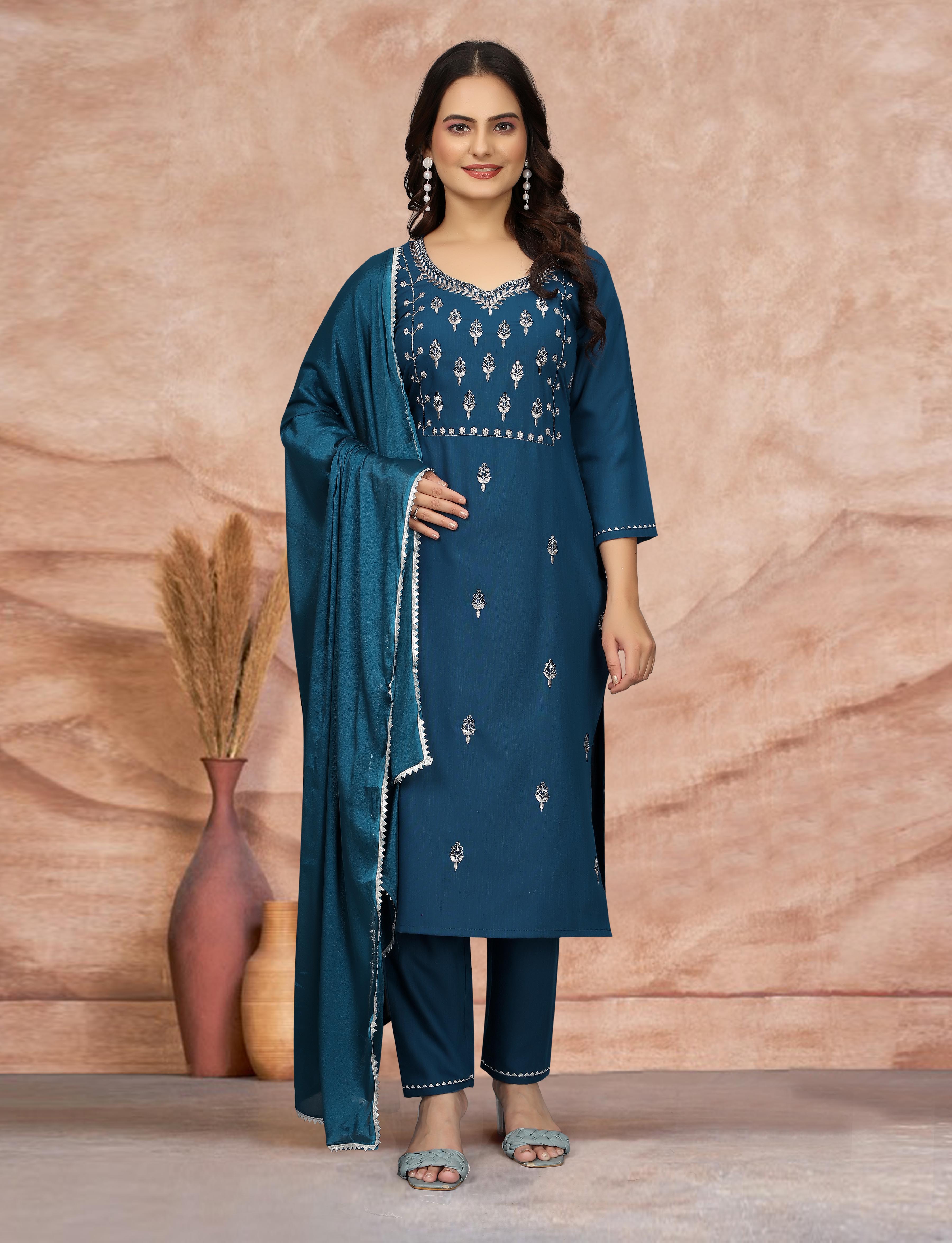 Model in teal blue embroidered cotton blend kurti set with silk dupatta, front view.