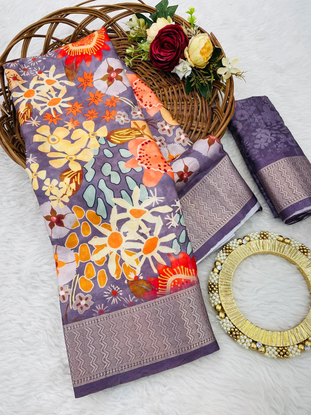 Latest designer printed Dola silk saree with a matching blouse piece, elegantly draped on a model.