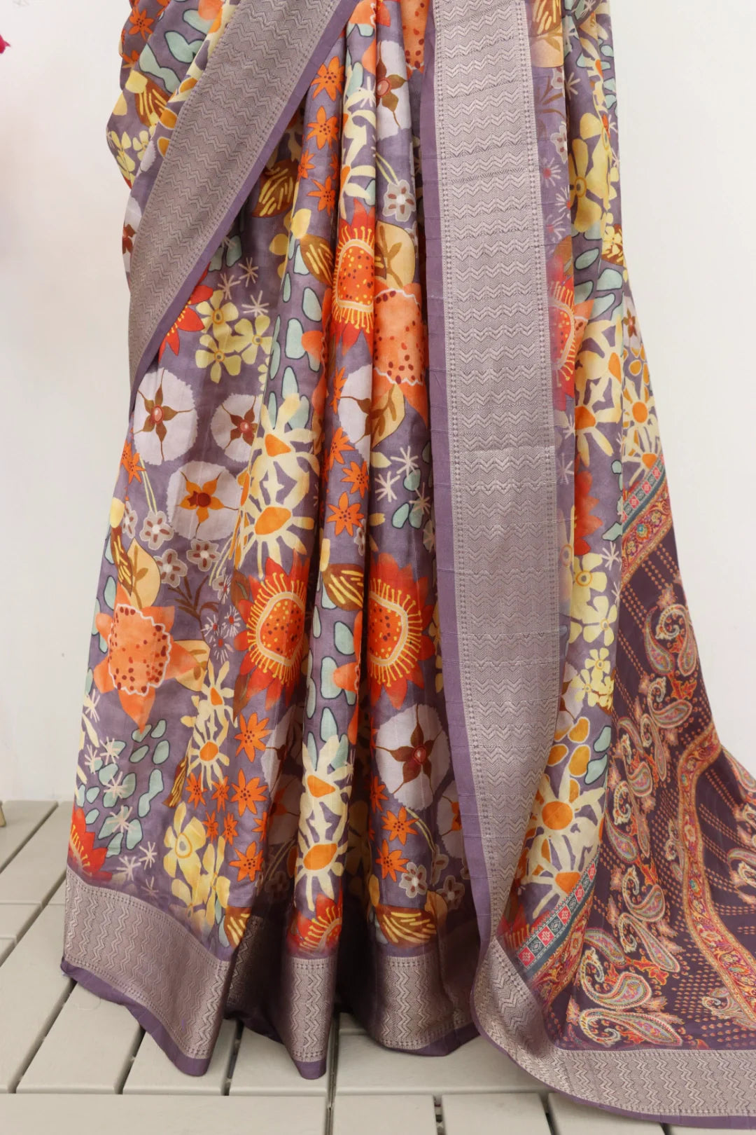 Latest designer printed dola silk saree with vibrant patterns, worn by a model