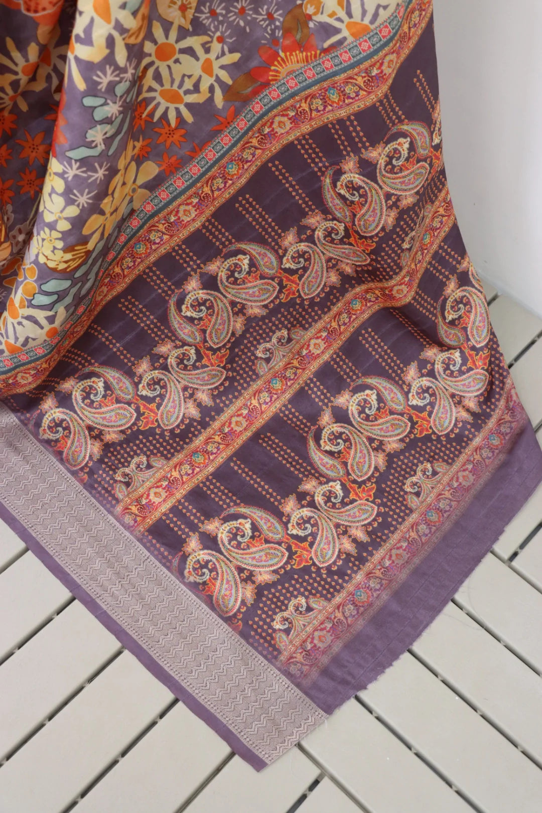 Vibrant latest designer printed Dola silk saree modeled by a woman