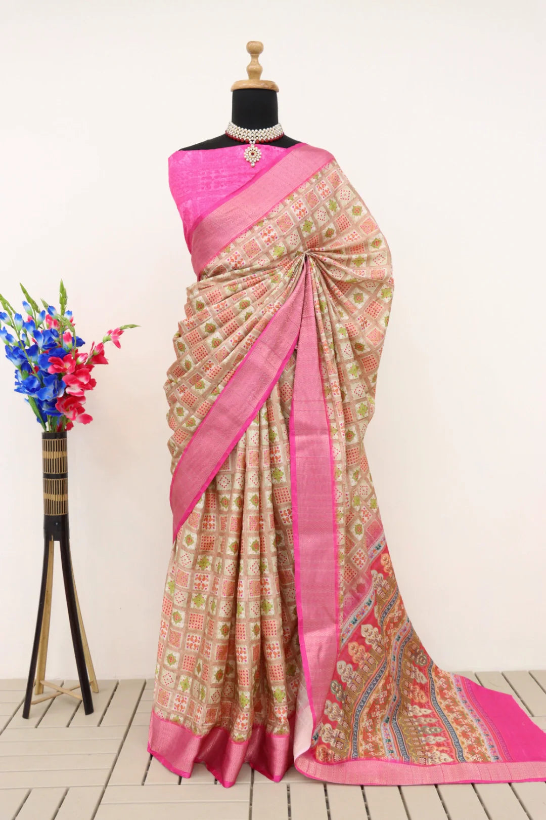 Latest Dola Silk digital printed saree with vibrant, intricate patterns and an elegant drape, worn by a woman.