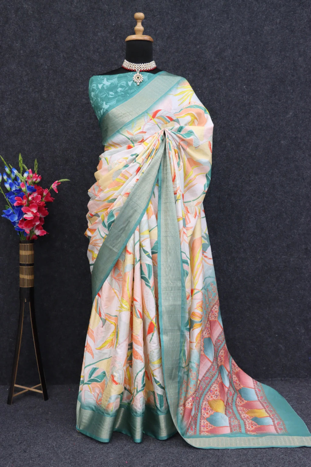 Close-up of intricate digital floral prints on cream silk fabric