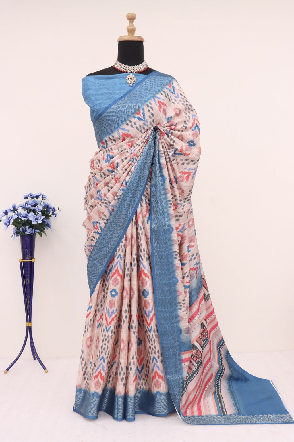 Elegant skin and blue printed silk saree