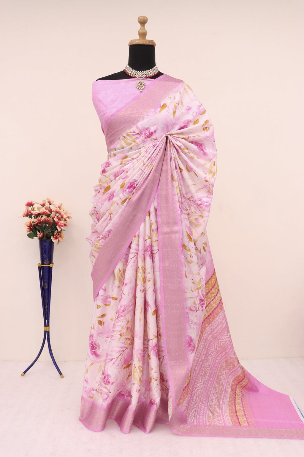 Baby pink printed saree elegantly draped.