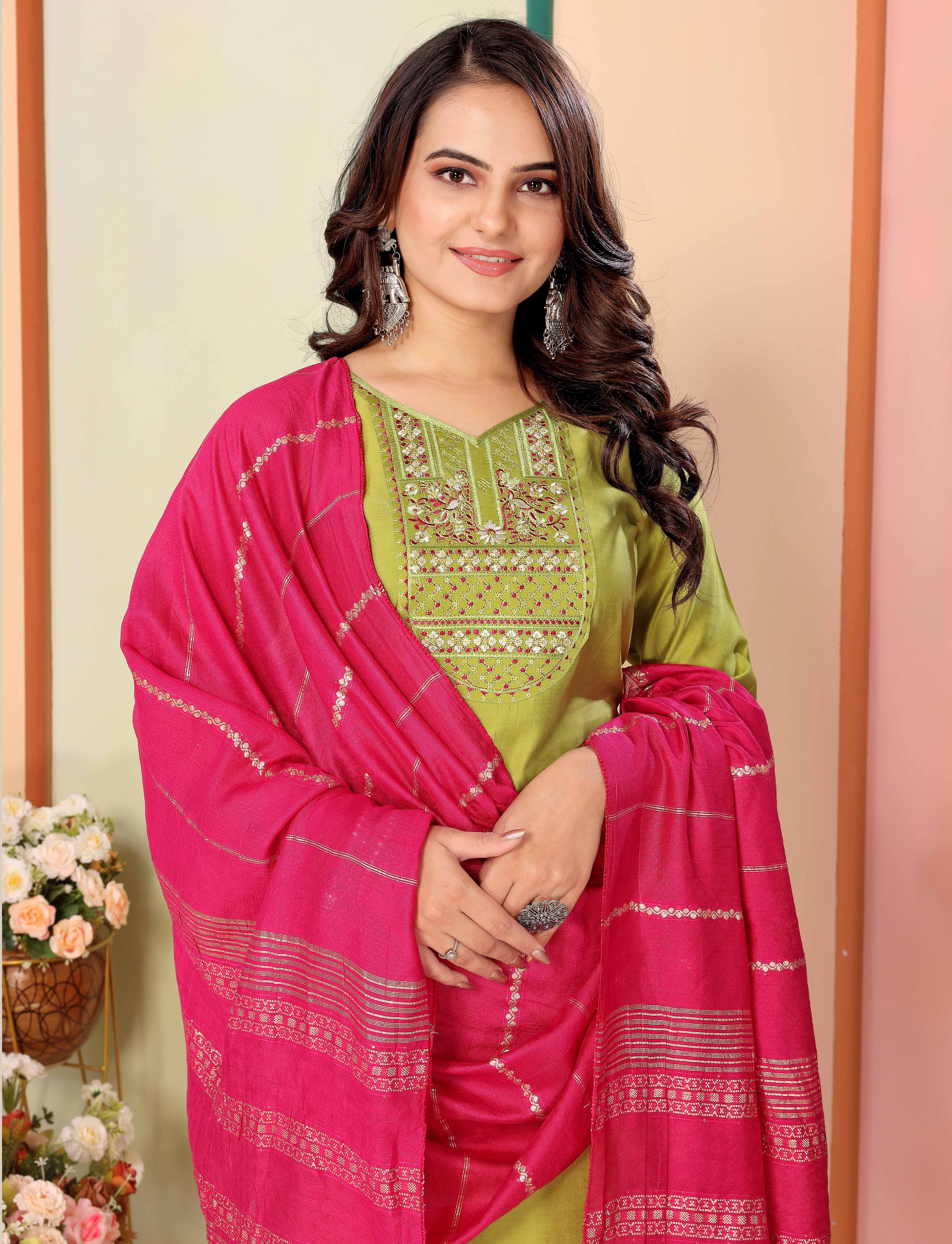 Close-up of model smiling, wearing lime green embroidered silk kurta with a vibrant pink chanderi dupatta draped, showcasing intricate neckline work from TRENDBUY.