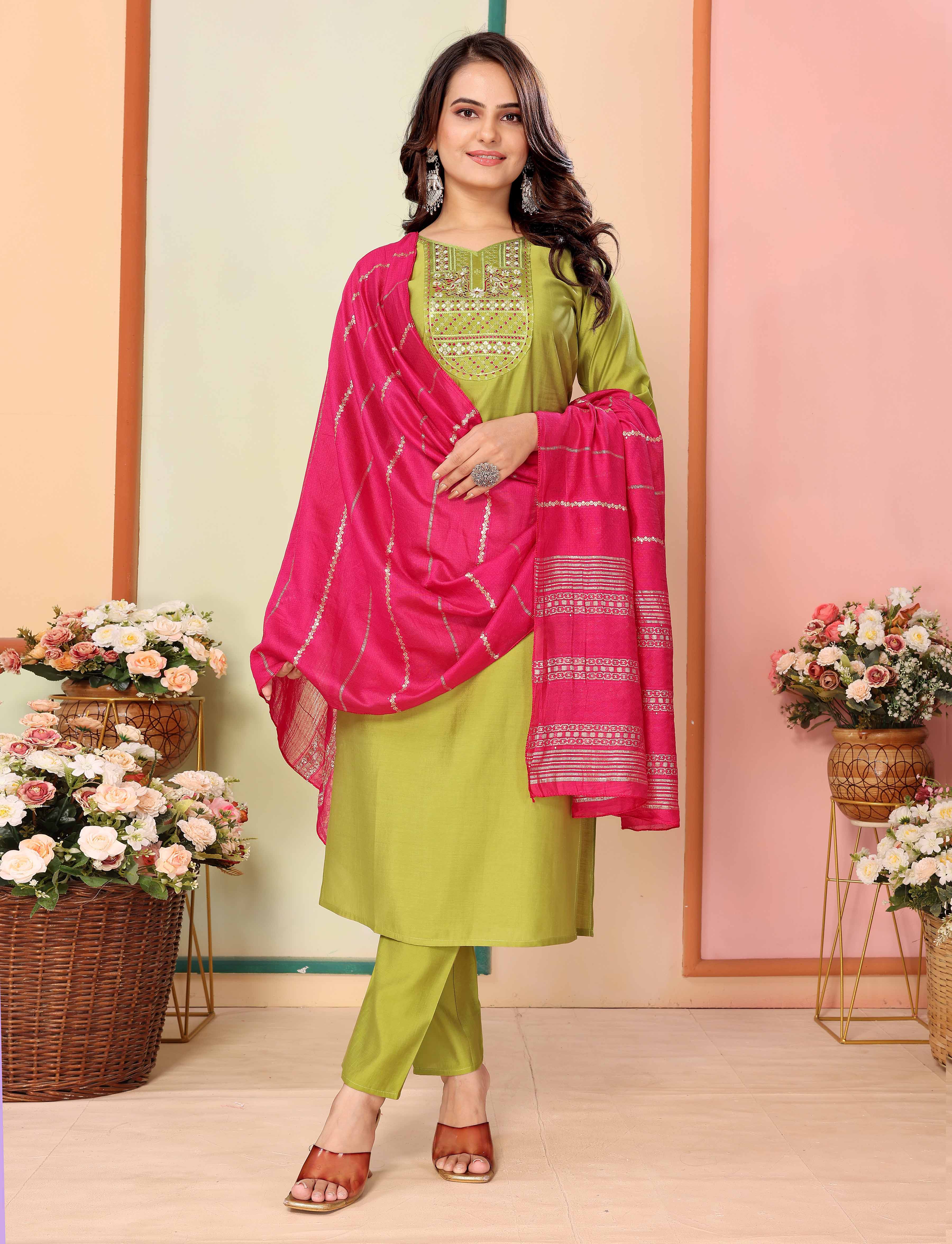 Model full length, smiling, showcasing the lime green embroidered silk kurta with pant and pink chanderi dupatta, hands clasped, a TRENDBUY ethnic wear.