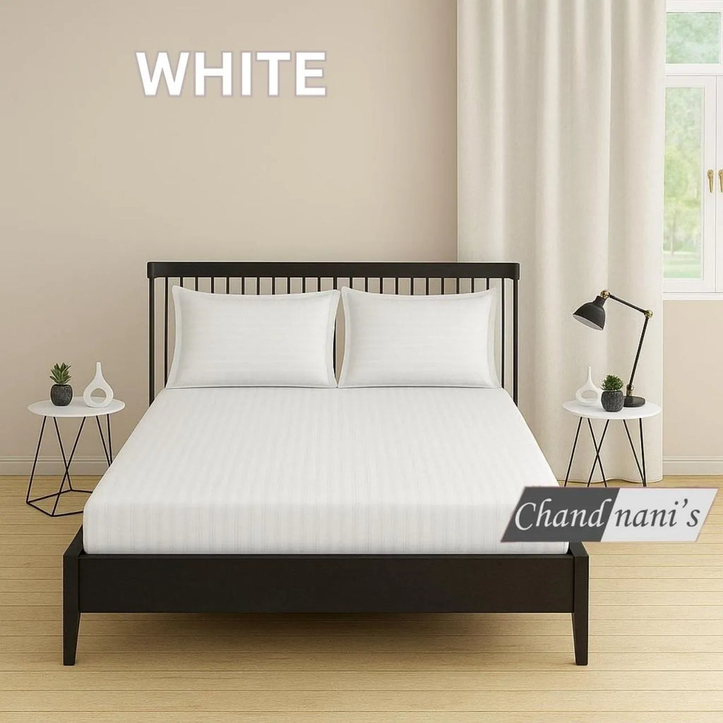 White striped cotton super king bedsheet with two matching pillow covers on bed