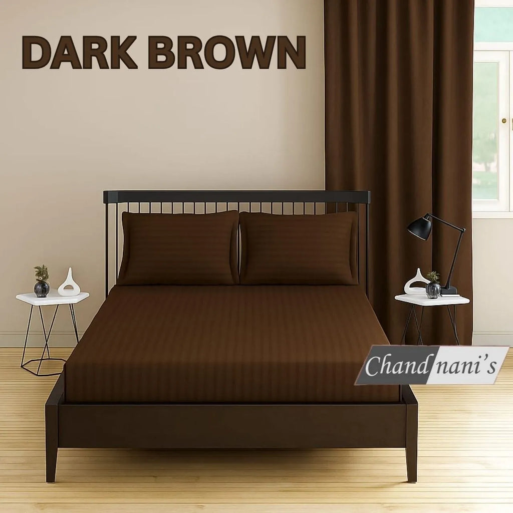 Dark brown striped elastic fitted cotton bedsheet on bed with two pillow covers