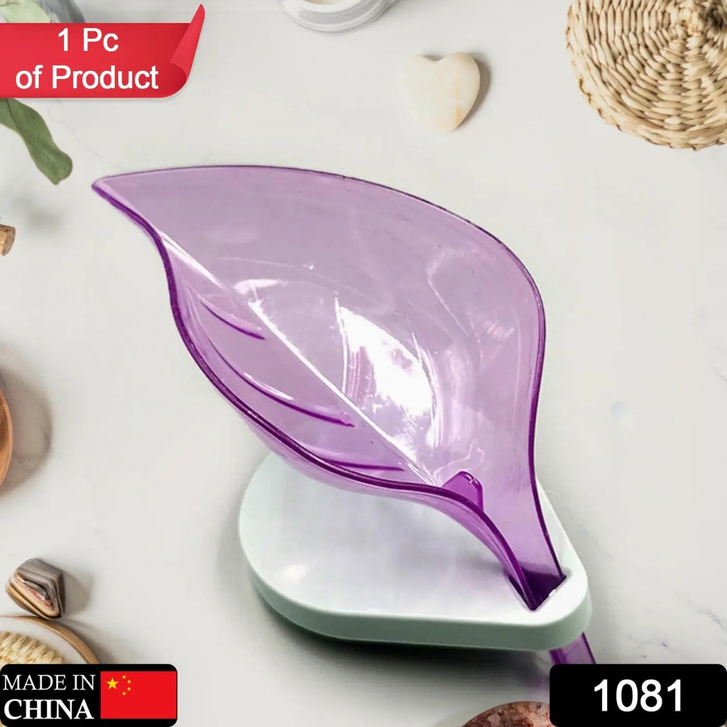Green self-draining leaf soap tray with suction cup for bathroom and kitchen.