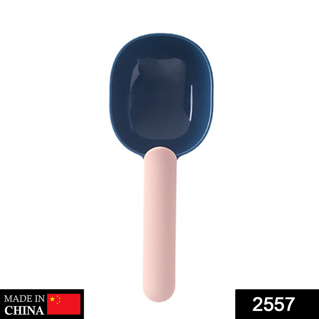 Food-grade ABS pet food shovel with handle clip design, scooping kibble from a bag.