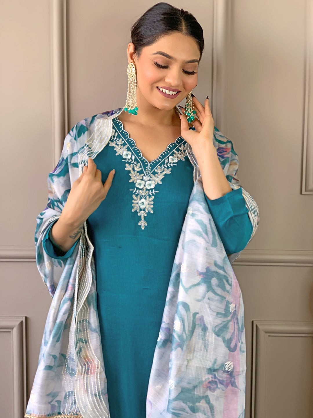 Model posing playfully in TRENDBUY D468 Rama green kurti set, highlighting the fluidity and design of the dupatta.