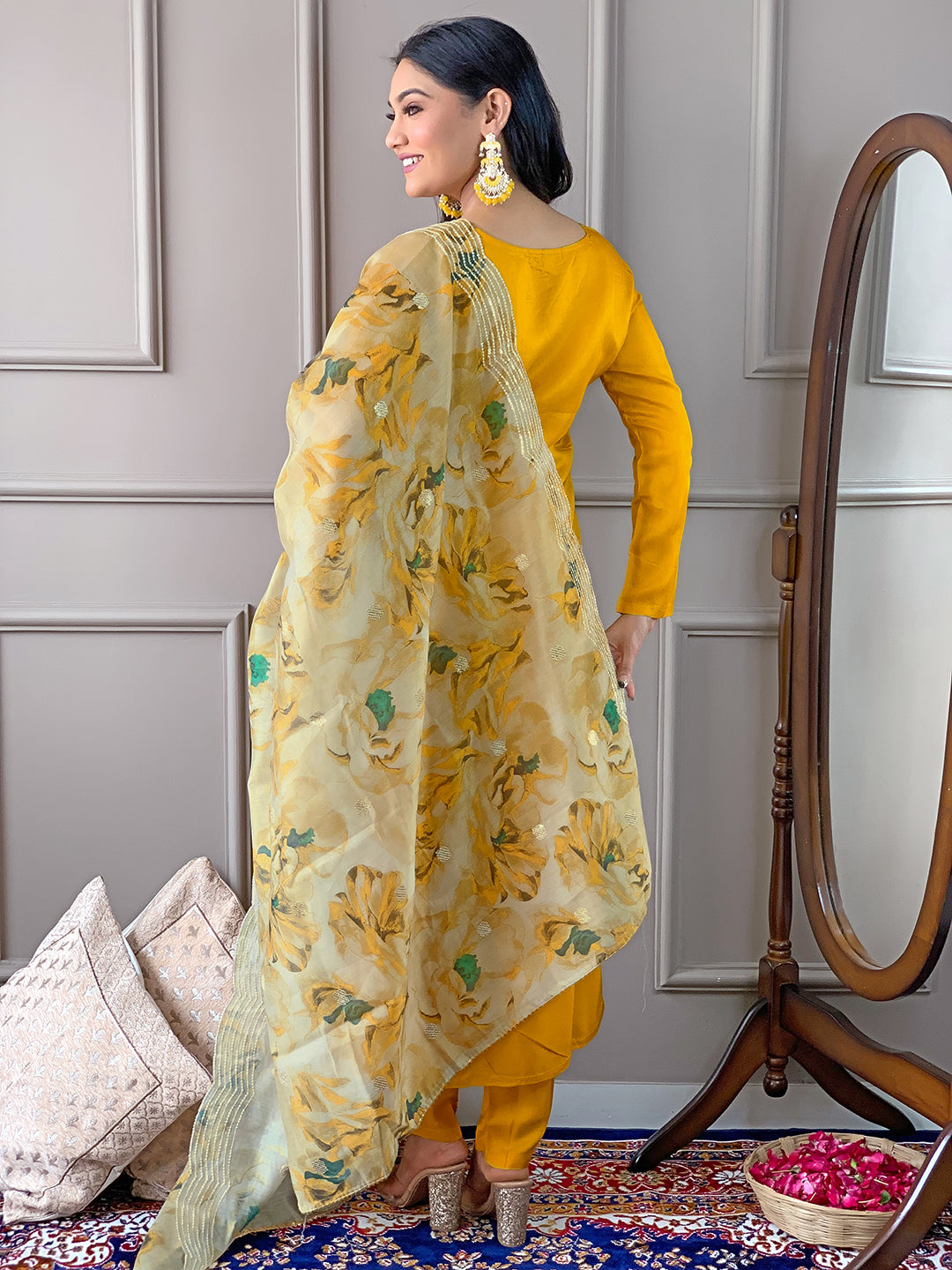 Back view of TRENDBUY D468 Yellow kurti set, highlighting the vibrant floral Chanderi dupatta draped across the back.
