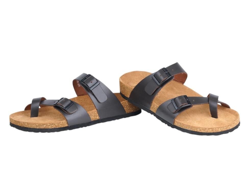 Pair of cork sandals with black straps on a white background