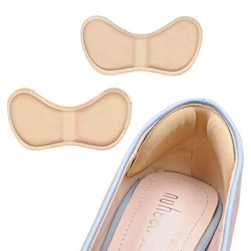 Two pairs of beige shoe inserts next to a shoe with 'Miu Miu' branding.