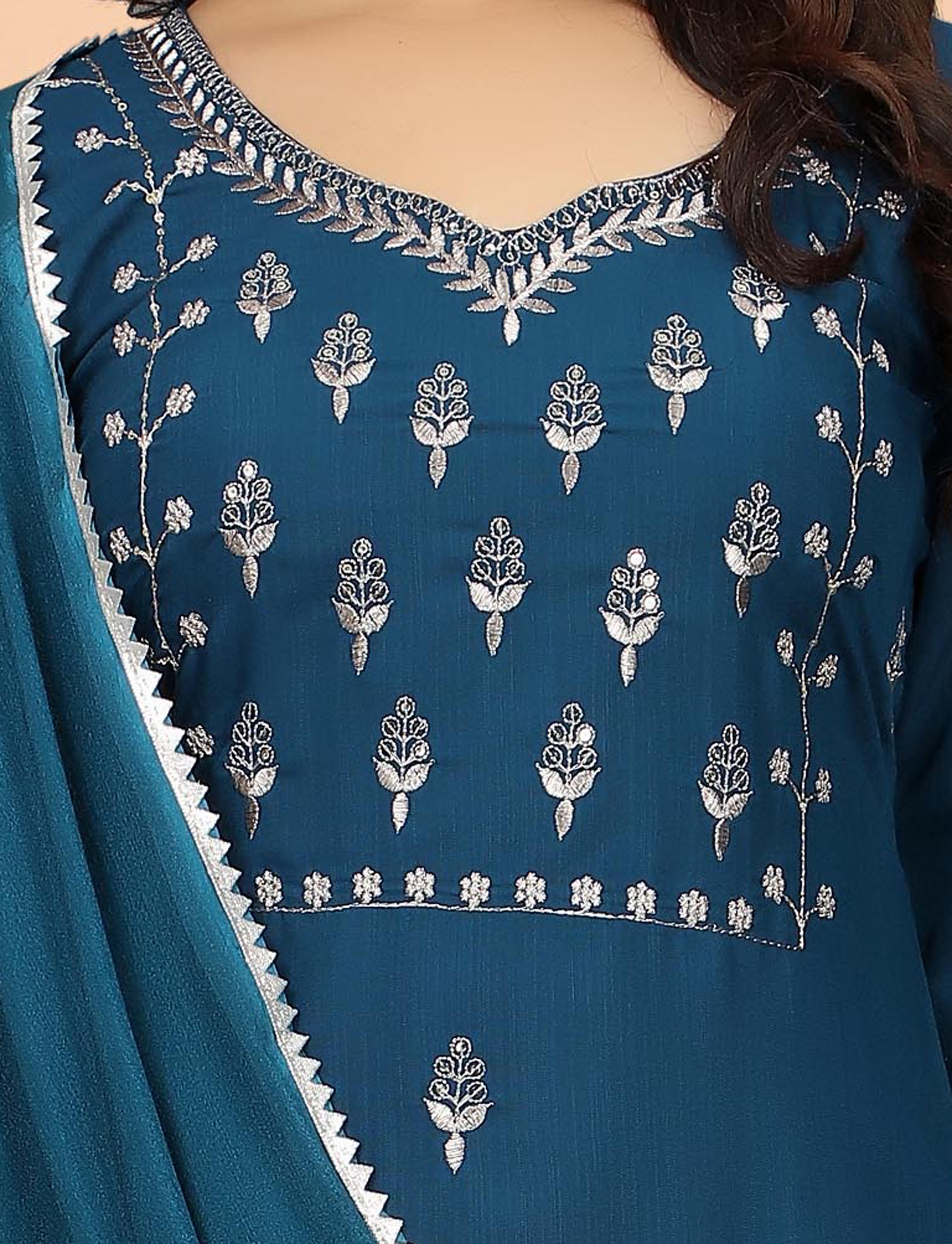 Close-up of intricate silver embroidery on the neckline and front of the teal blue kurti.