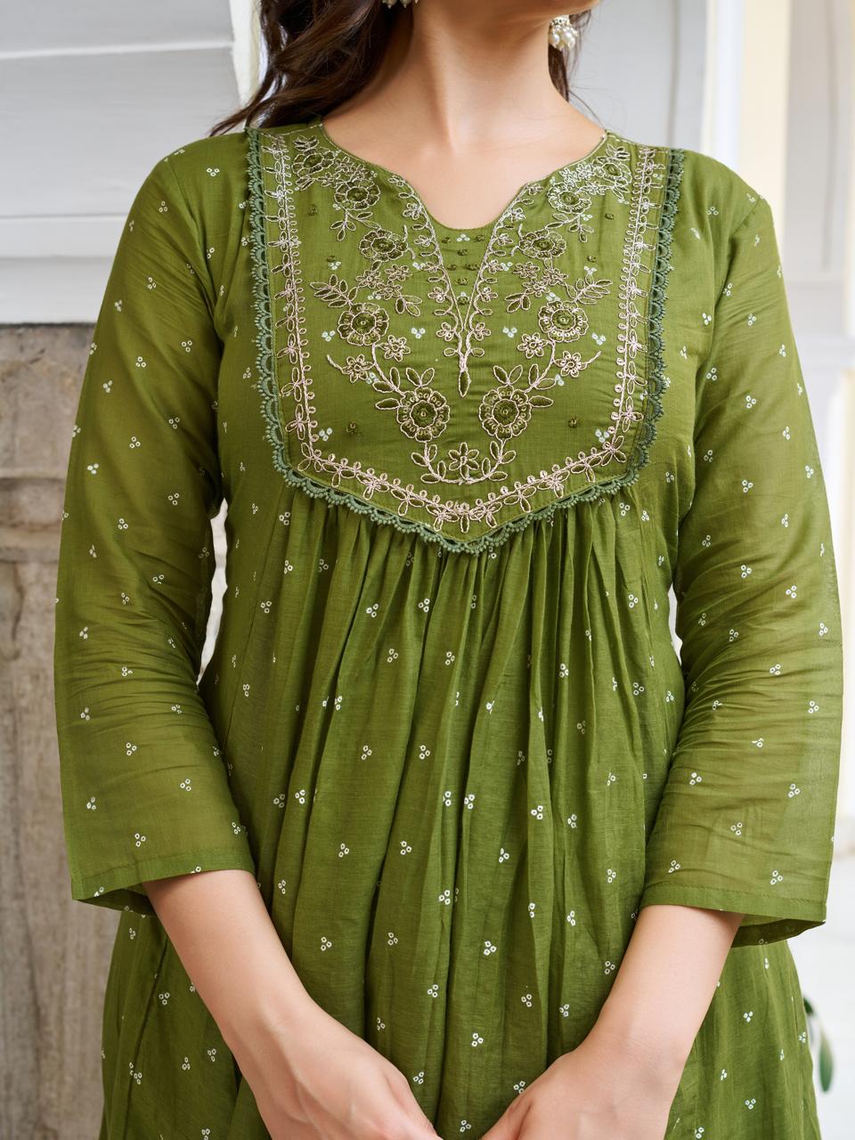 Detailed close-up of the olive green kurti's embroidered V-neckline and gathered bust design, highlighting the subtle print and texture.
