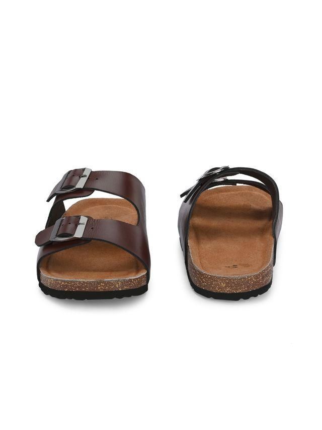 Brown sandals with cork sole on a white background