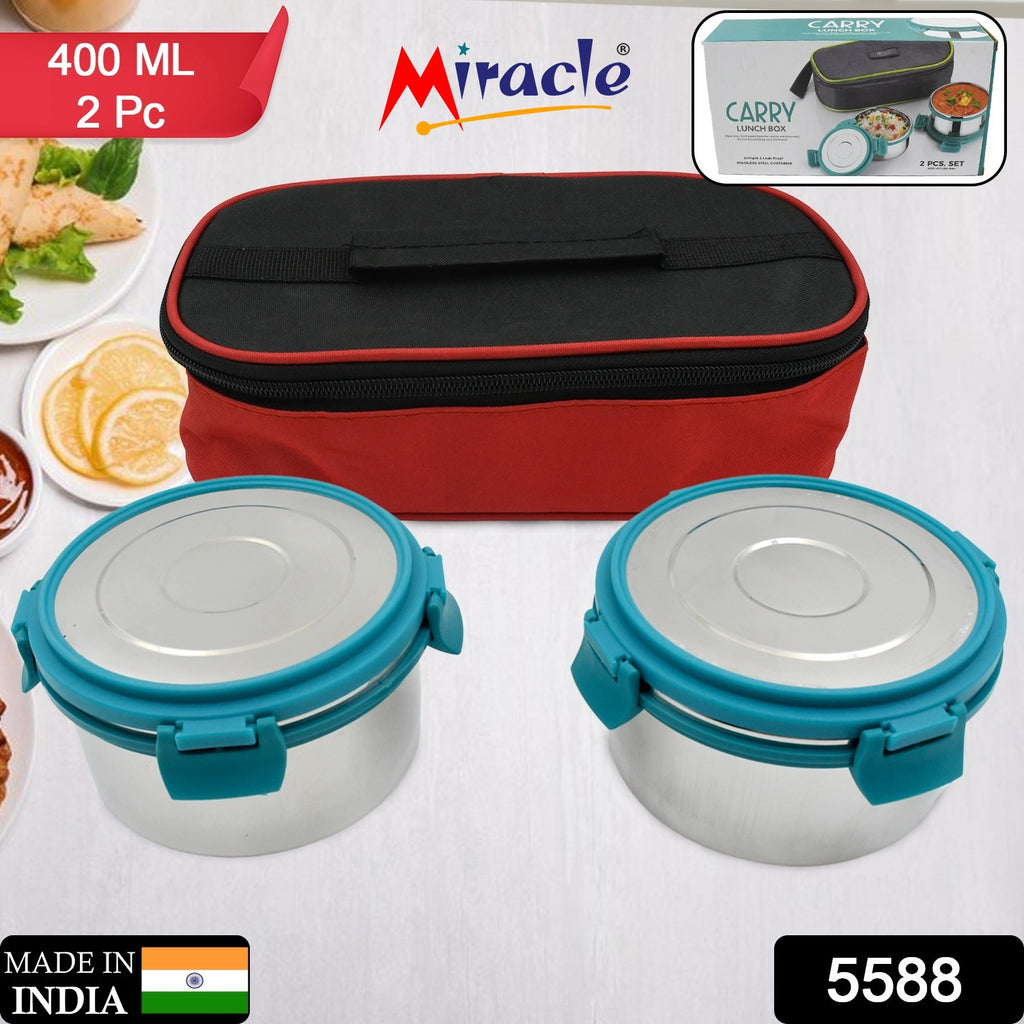 Green & pink 2-compartment lunch boxes with clear lids & grey insulated carry bag.