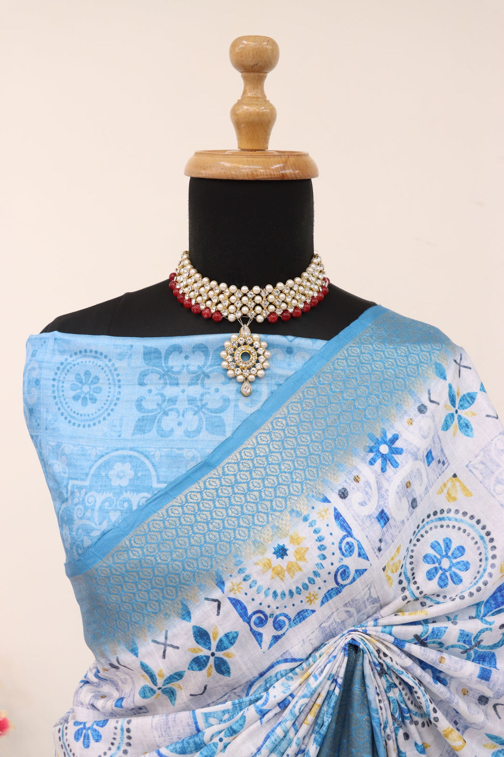 Close-up of intricate digital floral prints on soft pastel blue fabric