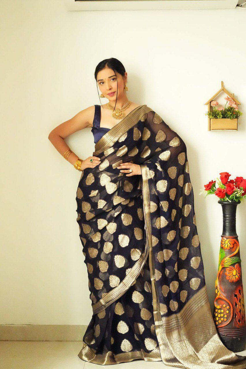 Full shot of TRENDBUY's instant saree, featuring a model in a pose that emphasizes the beautiful drape and all-over silver zari work on the dark base.