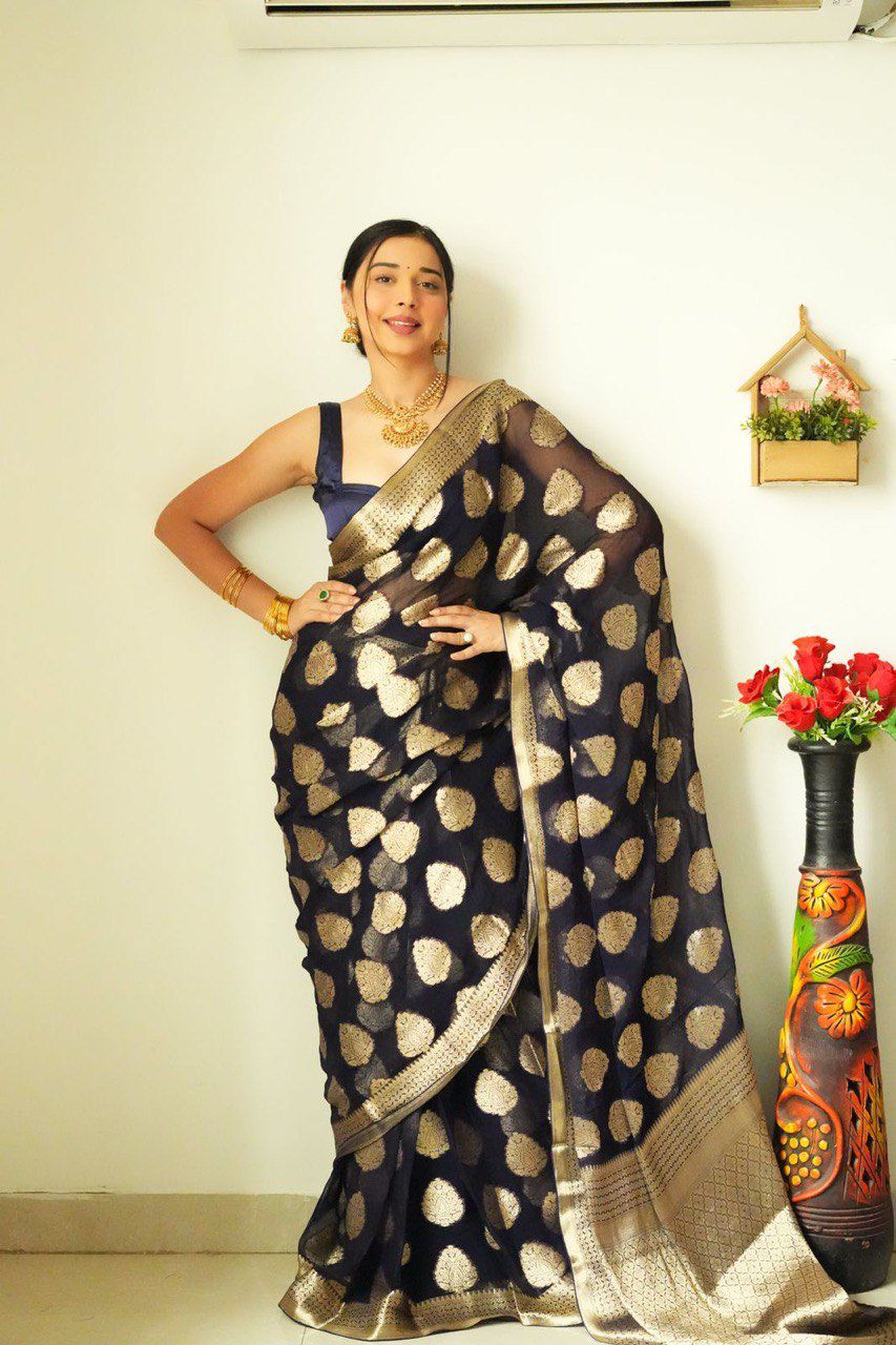 Model presenting the TRENDBUY 1-minute wear saree, showcasing its sophisticated design and comfort, with gold jewelry complementing the saree's zari work.